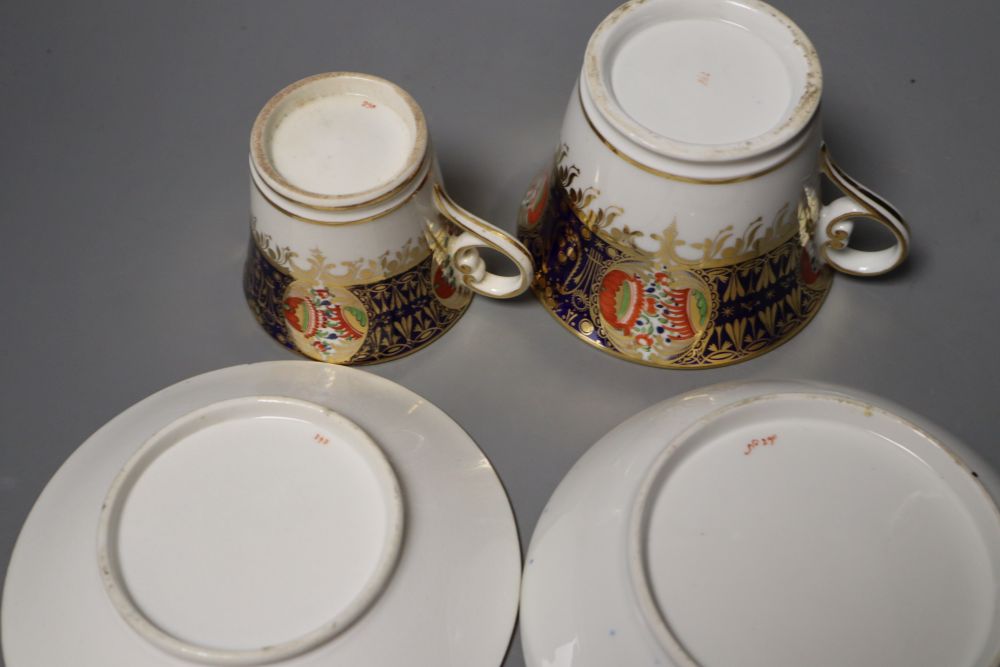 A Chamberlain Worcester cup and saucer in an imari style and a small cup and saucer in the same pattern, 15.5cm